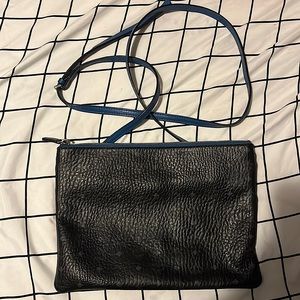 Blue MCM crossbody bag.
